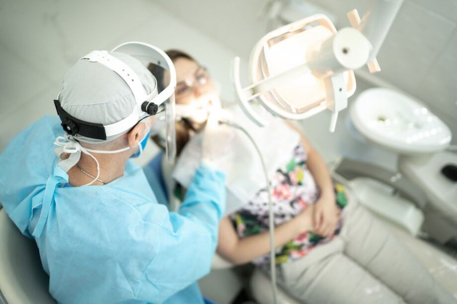 woman having dental work done by dentist